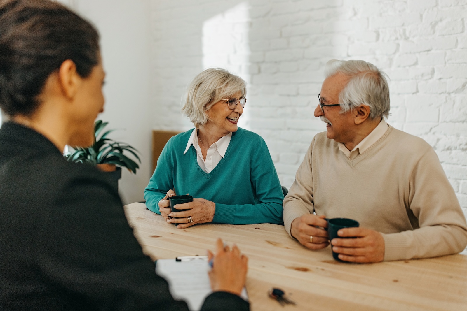 Elderly clients discuss Will and Lasting Power of Attorney with experienced Private Client solicitor in Burgess Hill